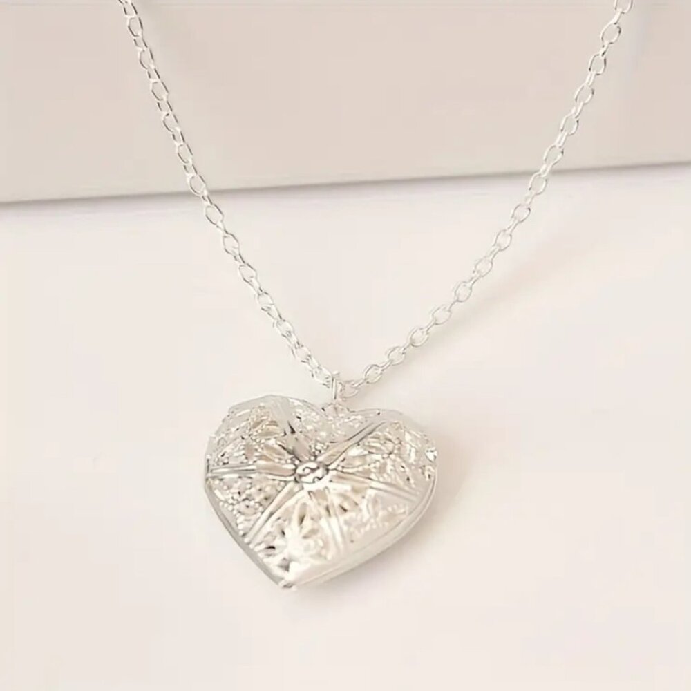 Elegant Heart-Shaped Hollow Metal Photo Locket Necklace. Sterling Silver.